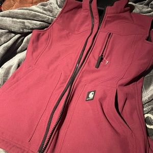 Like new Carhart Womens fitted vest, cranberry and black. Inner zip pocket.